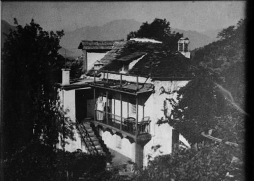 a black and white photo of a house with a balcony at Tenuta Casa Cima - tenutacasacima com - in Gudo