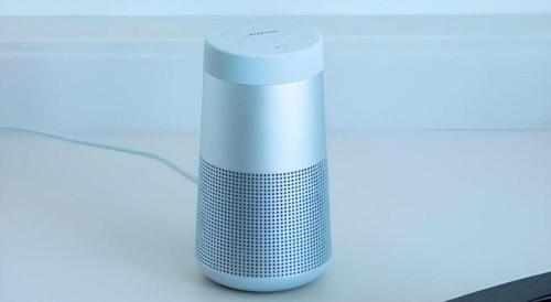 a white speaker sitting on top of a table at Yokohama Royal Park Hotel in Yokohama