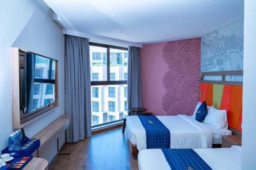 Postel nebo postele na pokoji v ubytování Condotel Highfloor Sea View - Apec Mandala Mui Ne