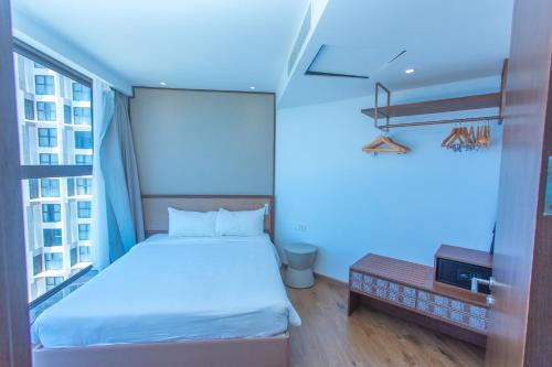 Postel nebo postele na pokoji v ubytování Condotel Highfloor Sea View - Apec Mandala Mui Ne