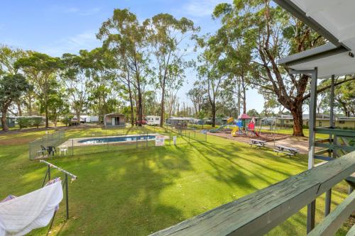 an image of a park with a playground at Kalganyi Holiday Park in Mount Gambier