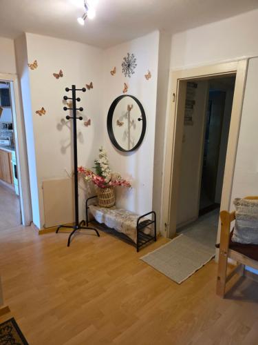 a living room with a chair and a picture on the wall at FAMILIE BRANDT in Bad Ischl