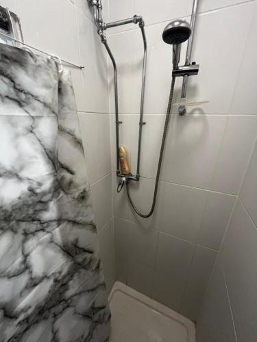 a bathroom with a shower and a toilet at close to stadium and the beach 2 bed groundfloor,sky Netflix in Grimsby