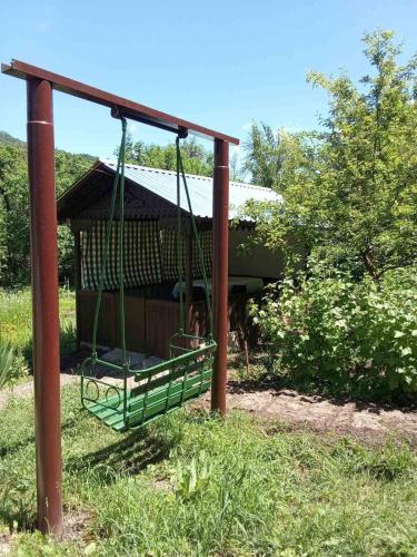 a swing in front of a gazebo at Sunny Lodge Dilijan in Dilijan