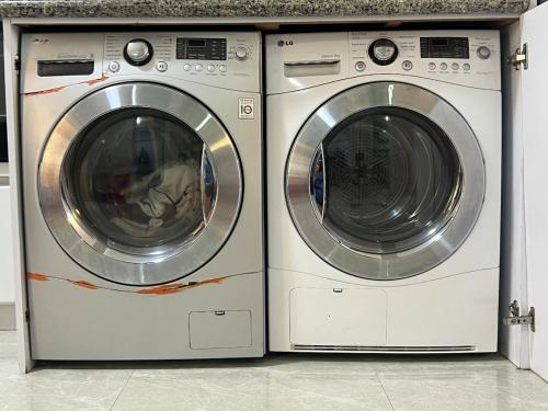 two washing machines are sitting next to each other at Premium Lecheria - Oceanfront, Pool & Relax in Morro de Barcelona