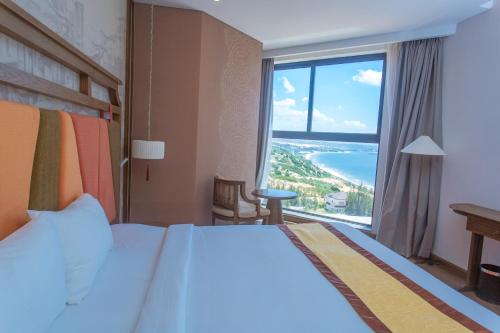 Postel nebo postele na pokoji v ubytování Condotel Highfloor Sea View - Apec Mandala Mui Ne