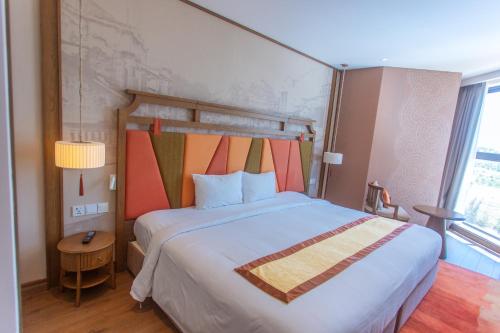 Postel nebo postele na pokoji v ubytování Condotel Highfloor Sea View - Apec Mandala Mui Ne
