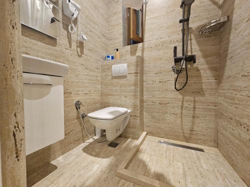 a bathroom with a toilet and a shower at Patrik Patrik in Kotor