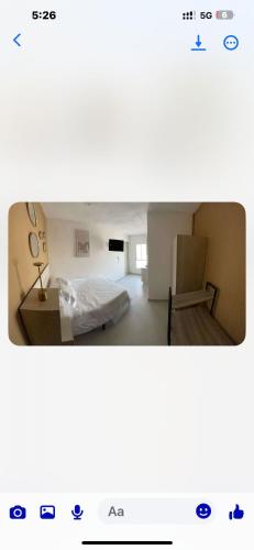 a screenshot of a room with a bed and a chair at RC Studio loft san Jerónimo in Miravalle