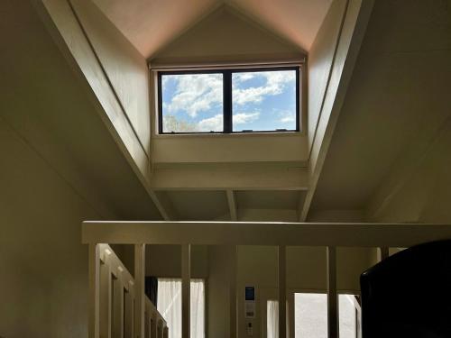 a skylight in a room with a window at Airport Manor Inn in Auckland