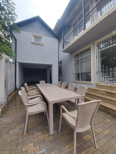 a patio with a table and chairs on a patio at Quba Panoramik Villa in Quba