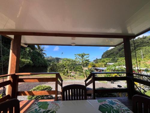 a view from the inside of a porch with a table and chairs at Tuna House in Maroe