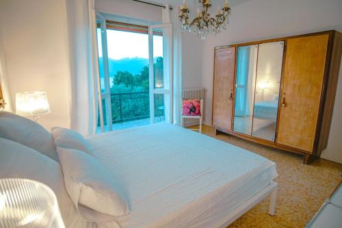 Кровать или кровати в номере LA LIMONAIA Vista Lago