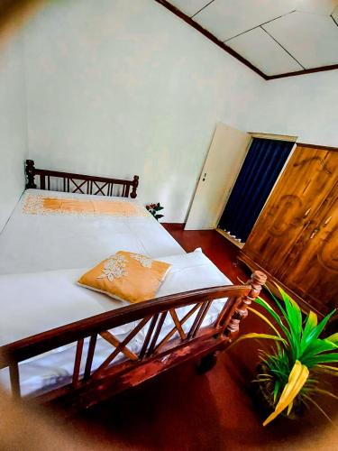 a room with two beds in a room at Abhi Villa in Beruwala