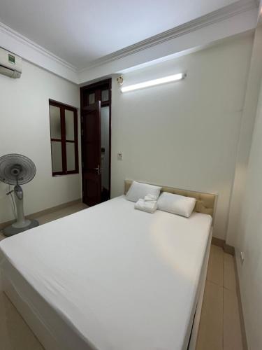 Postel nebo postele na pokoji v ubytování Phòng trọ bình dân