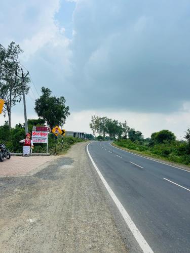 a sign on the side of a road at Hotel Sanskar in Dodi