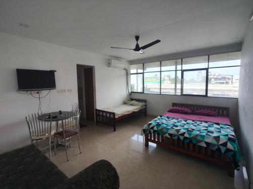 Ένα ή περισσότερα κρεβάτια σε δωμάτιο στο Green Garden Apartments