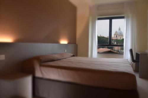 Postel nebo postele na pokoji v ubytování TH Assisi - Casa Leonori