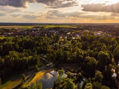 an aerial view of a city with trees and a river at Bungalow in Lübben with a terrace in Lübben