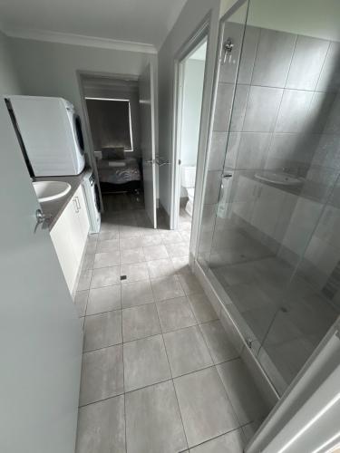 a bathroom with a shower and a sink at The Foxes Den- secure yard, WIFI in Geographe