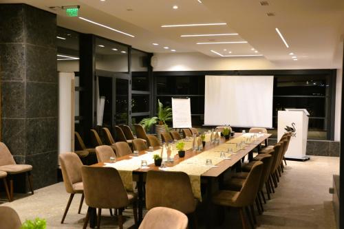 a large conference room with a long table and chairs at Park Lakeside Ohrid in Ohrid