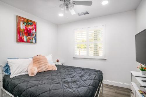 a bedroom with a bed and a flat screen tv at Remodeled 1 Acre Ranch Home in Madera in Madera