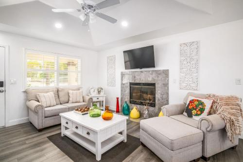 a living room with a couch and a fireplace at Remodeled 1 Acre Ranch Home in Madera in Madera