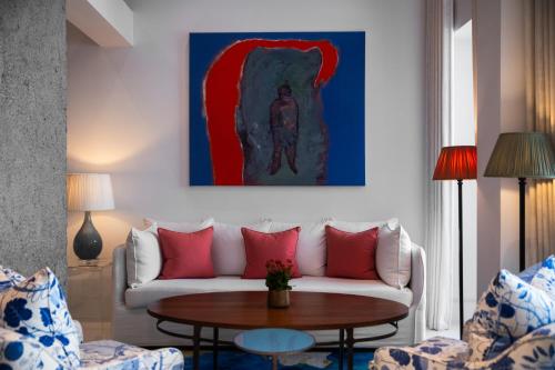 a living room with a couch and a table at The Merchant House in Manama