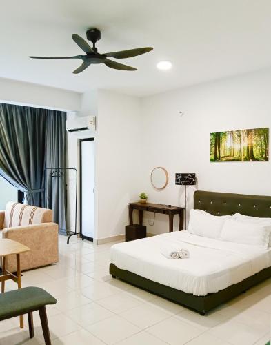 a bedroom with a bed and a ceiling fan at Studio with Rooftop Pool at Youth City Nilai by D'KAY HOMES, near USIM KLIA in Nilai
