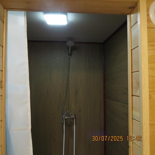 a shower in a room with a ceiling at Bright Terelj Family Camp in Dugang Süme