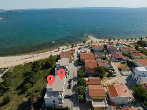 an aerial view of a beach with houses and the ocean at VIRCATION Apartments in Vir
