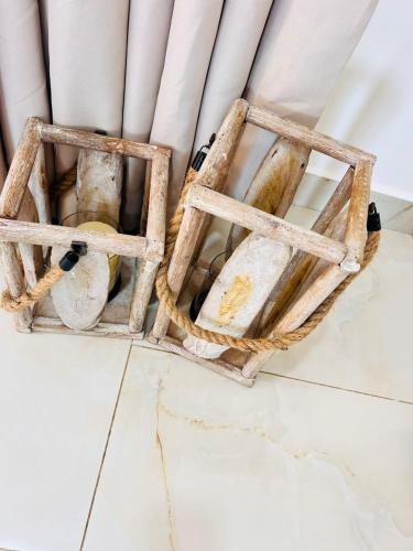 a basket of pipes on a floor next to a window at Sandy shores in Kilifi