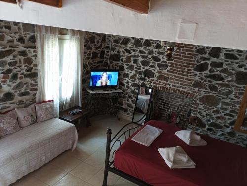 Μια τηλεόραση ή/και κέντρο ψυχαγωγίας στο Traditional stone house in Mytilene