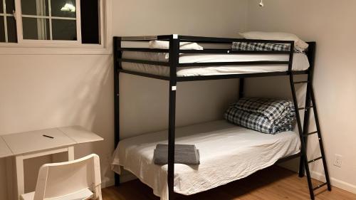 a room with two bunk beds and a desk at Olive Startup House in Palo Alto