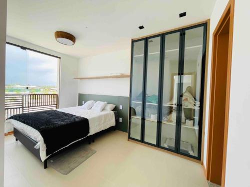 Postel nebo postele na pokoji v ubytování Condominio Frente Mar 3 suites com Ar Cond piscina e Hidro privativa