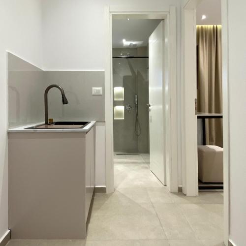 a bathroom with a sink and a shower at The Didani Villa in Sarandë