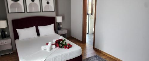 a bedroom with a bed with a cross and christmas decorations at Hotel Fantazia Oradea - Self Check In & Out in Oradea