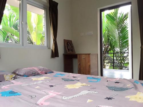 Katil atau katil-katil dalam bilik di SriMahi Farmhouse