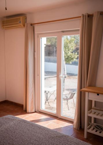 a sliding glass door with a view of a patio at La casa Zamora in Totana