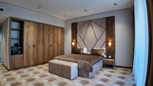 Postel nebo postele na pokoji v ubytování Cihan Town Hotel