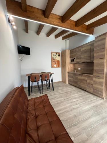 a living room with a couch and a table at AMC Boente in Arzúa