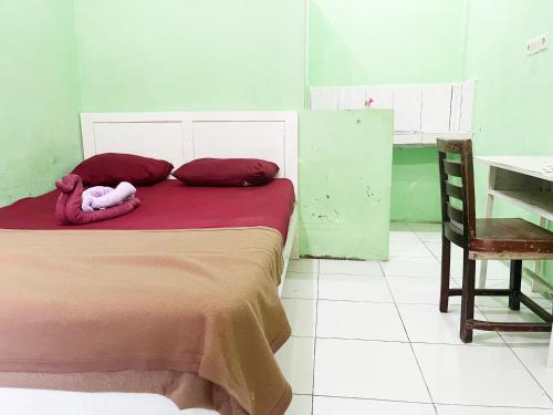 Ένα ή περισσότερα κρεβάτια σε δωμάτιο στο Zella Kost & Homestay