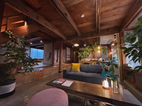 a living room with a couch and a table at junos in Nahari