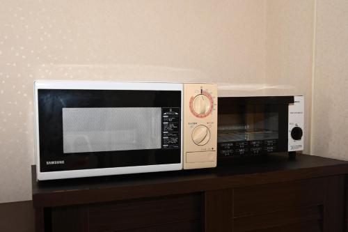 Una cocina o zona de cocina en アイリスイン知立