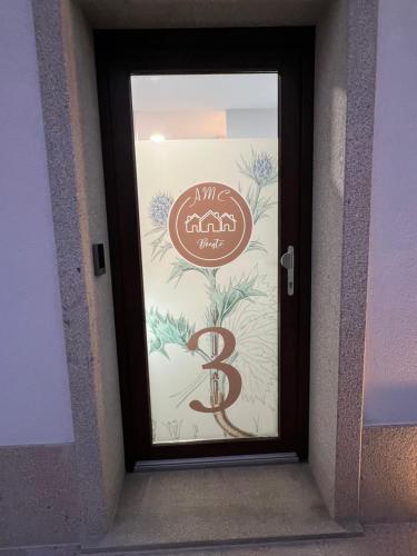 a door with a sign that says b on it at AMC Boente in Arzúa