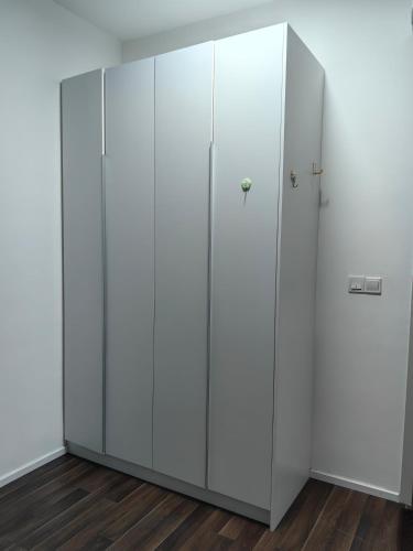 a pair of white cabinets in a room at Geo Bukit Rimau Condominium in Shah Alam