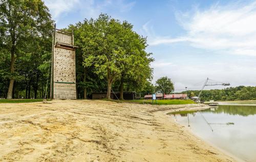 a brick tower next to a body of water at 2 Bedroom Beautiful Home In Erm in Erm