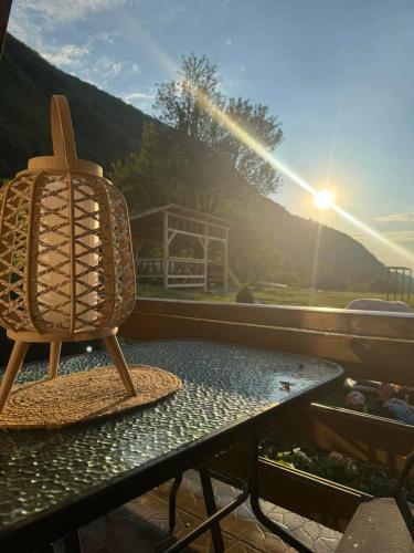 a wooden chair sitting on a table on a balcony at Monte Casa in Ivišovo Greblje