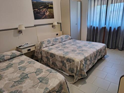 Katil atau katil-katil dalam bilik di Hotel Ai Tufi
