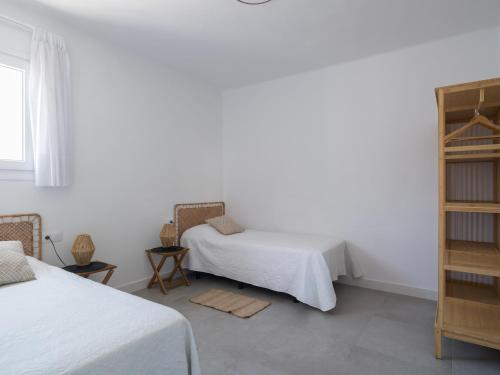 Ένα ή περισσότερα κρεβάτια σε δωμάτιο στο Apartamentos Marmolejos
